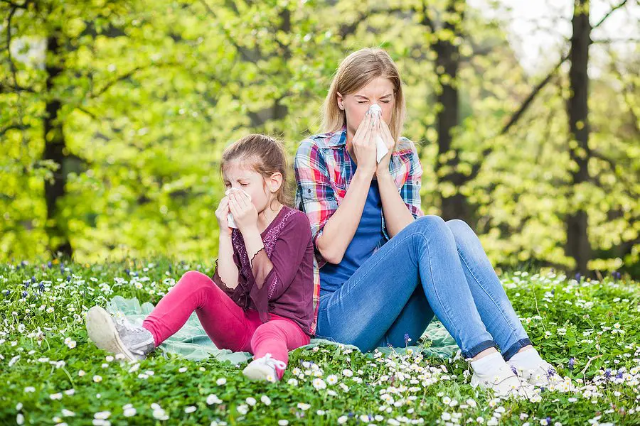 Allergy Relief mother daughter outside sneezing
