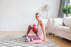 Happy woman drinking protein shake with good protein timing.