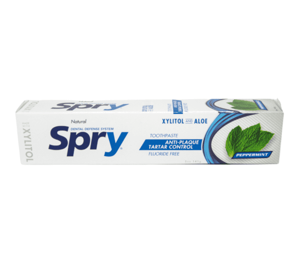 A box of spry toothpaste with mint leaves.