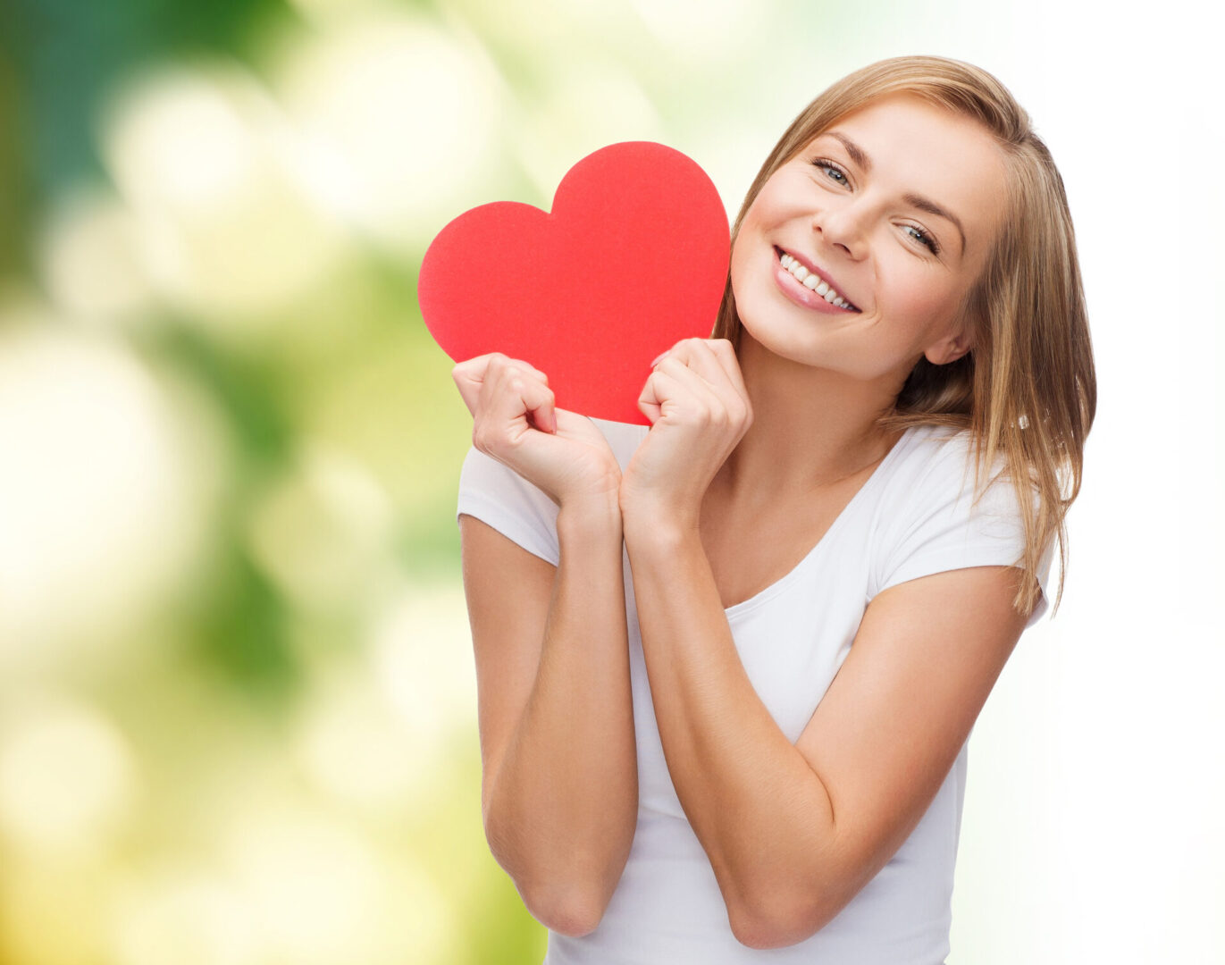 Happy woman with a healthy heart, support heart health naturally
