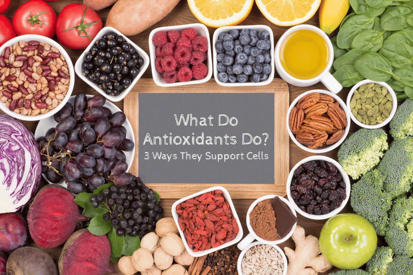 Antioxidant foods surrounging small chalkboard with Antioxidant for what do antioxidants do.