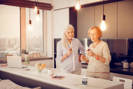 Woman reading a supplement label to learn how to choose quality supplements.