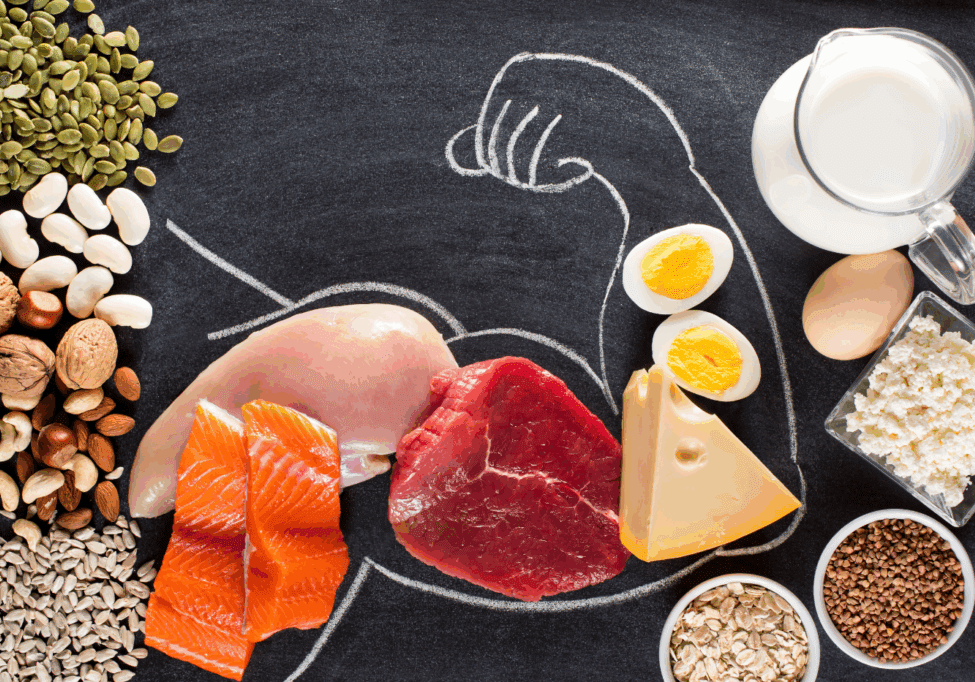 Chalk outline of a muscular arm with protein-rich food in the outline.