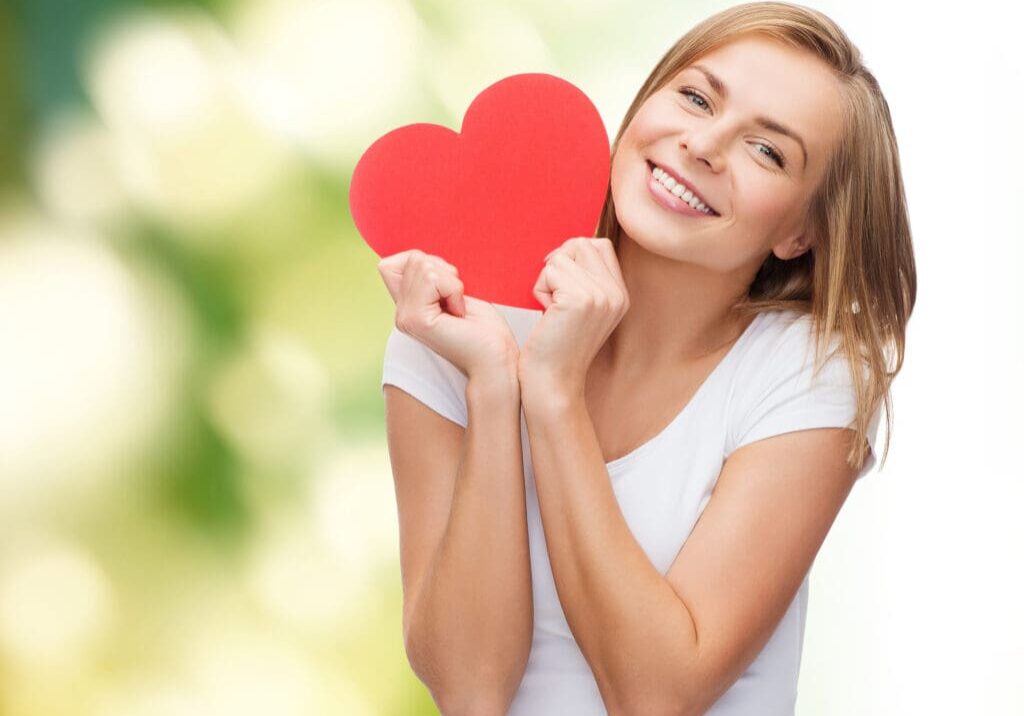 Happy woman with a healthy heart, support heart health naturally